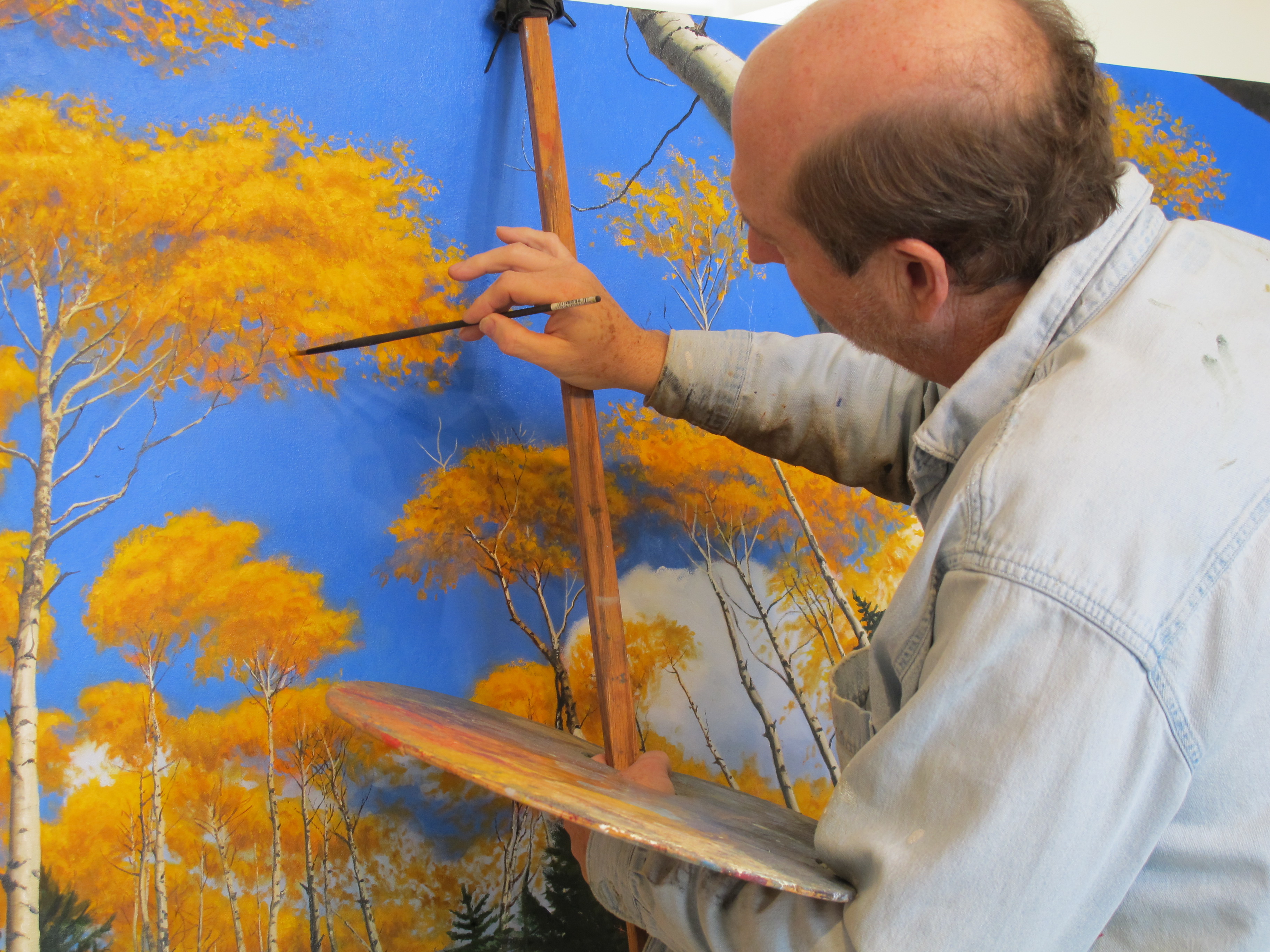 John Hulsey painting an oil of Aspen trees